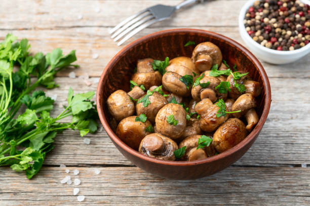 istock Fried mushroom champignon with onion and parsley 2159916685