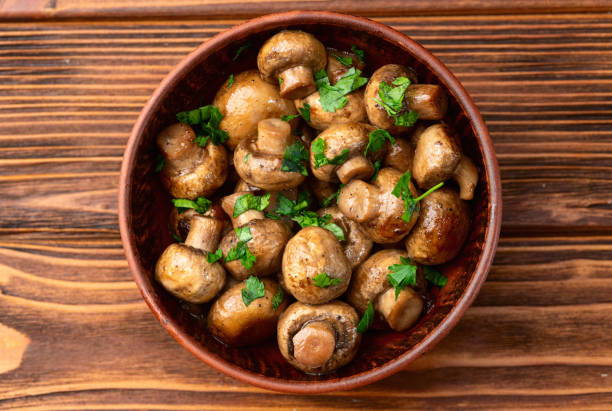 istock Fried mushroom champignon with onion and parsley 2159916690