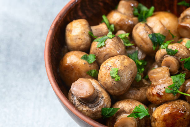 istock Fried mushroom champignon with onion and parsley 2159916697