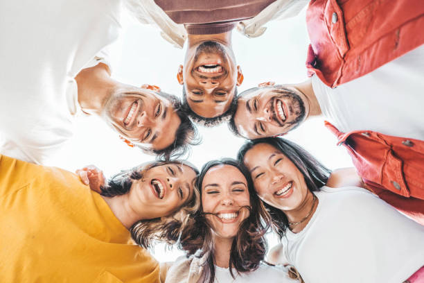 istock Multicultural young people hugging together and smiling at camera - Happy friends group taking selfie pic outside - Youth community concept 2159917280