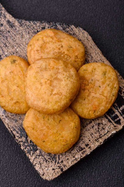 istock Round fish or chicken nuggets with salt and spices 2159917656