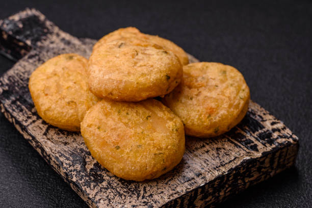 istock Round fish or chicken nuggets with salt and spices 2159917659
