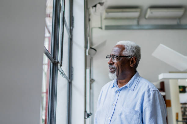 istock Senior man looking away contemplating 2159920548