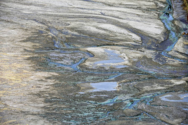 istock Striated Rock Formations with Acidic Water Channels 2159921103