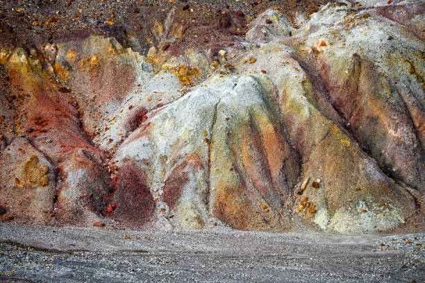 Detailed view of the earthy red and brown striated mineral layers in the Rio Tinto area, showcasing natural geological art