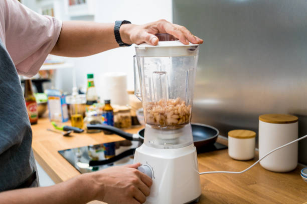 istock Chef at the kitchen preparing bean porridge with cauliflower and vegetables 2159923100
