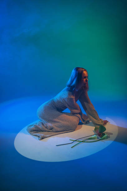 istock Woman with flower in studio. Surrealism. Neon light. 2159923638