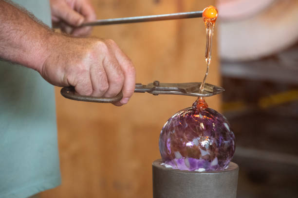 Glassblower Cutting Hot Glass