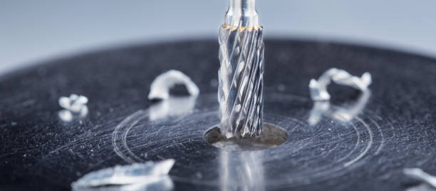 istock Milling cutter make sink in hole in steel billet. Locksmith work. 2159928979