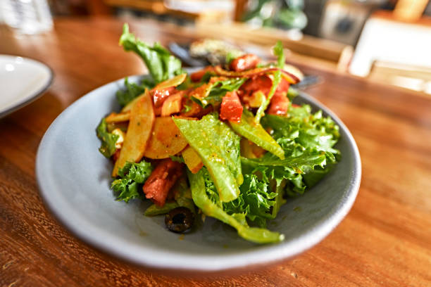 Feta Cheese Salad with vegetables on a wooden table