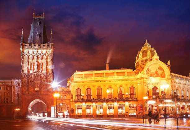 Prague, Czech Rep. - Jan 18, 2020: The illuminated Powder Gate (Prasna brana) and Municipal House in the centre of Prague at Namestí republiky square by night.