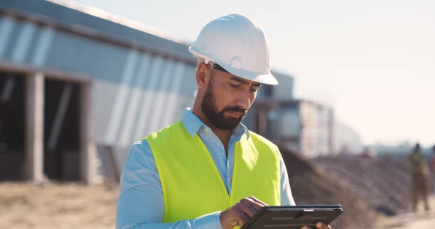 istock Search, tablet and architecture with man on construction site for industrial, engineering and planning. Logistics, networking and digital with contractor for project management and development 2159933142