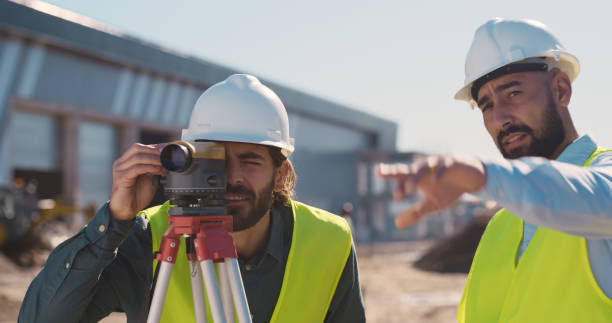 istock Teamwork, construction and men with camera for survey, building inspection and maintenance. Infrastructure, architecture and contractors take picture, time lapse and logistics for project development 2159933155