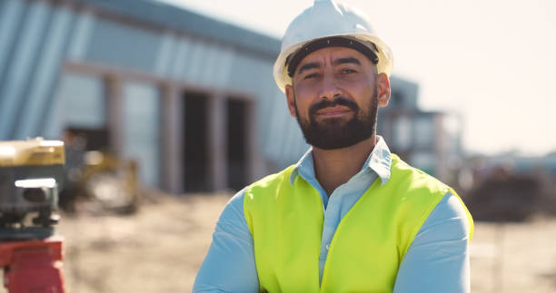 istock Construction, portrait and man at site for building maintenance, civil engineering and project management. Serious contractor, architecture boss and infrastructure for industrial property development 2159933157