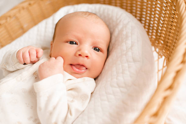 istock Baby boy lying in bed sleeping 2159933838