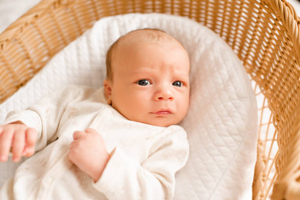 istock Baby boy lying in bed sleeping 2159933839