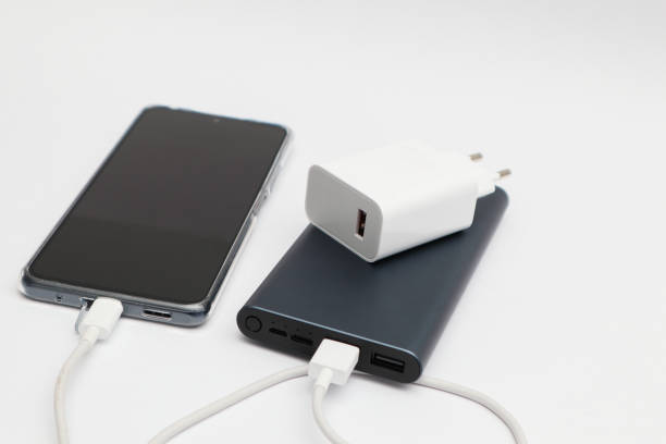 istock Power bank and smartphone on white background. Modern technology concept. 2159934512