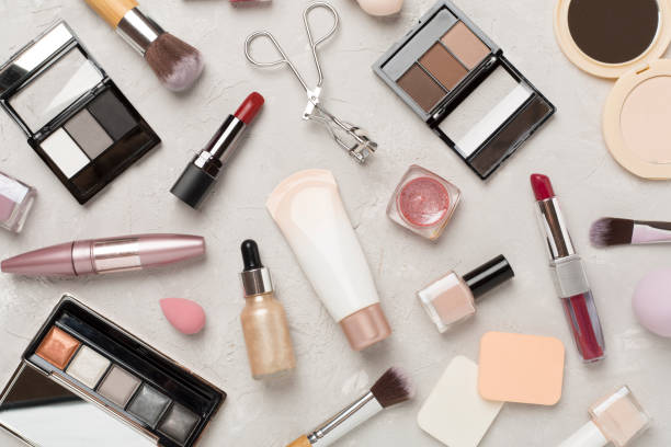 istock Flat lay with makeup products and tools on concrete background 2159935594