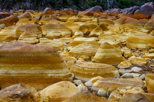 Orange Mineral Formations and Puddles at Rio Tinto