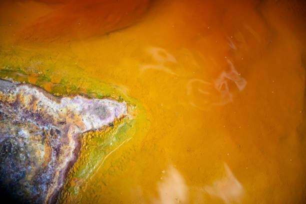 Close-up of the colorful mineral deposits and bacterial mats in the acidic waters of Rio Tinto