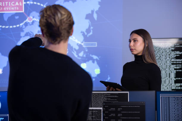 istock Cyber security team working in a Cyber Security Operations Center SOC to protect systems and technologies 2159939073