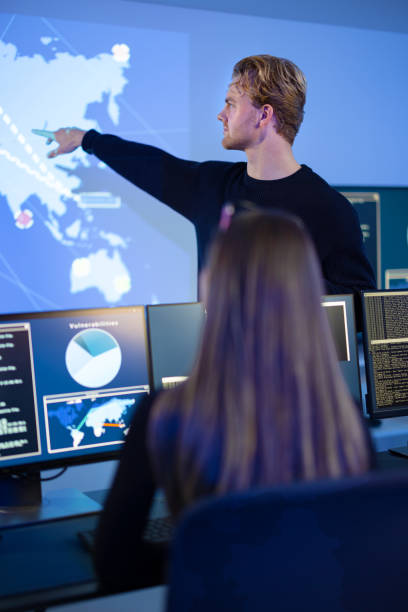 istock Cyber security team working in a Cyber Security Operations Center SOC to protect datacenter from security breach 2159939390