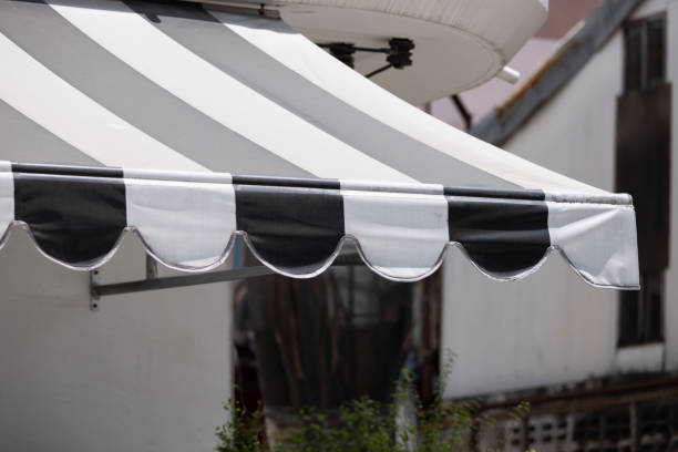 istock A black and white striped awning with a white stripe 2159941279