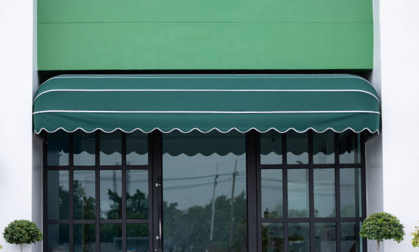 istock A green awning with a white trim sits over a storefront 2159941347