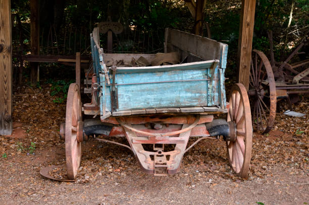 Covered wagon - rustic wooden Conestoga style - used on Oregon Trail by 19th century Wild West settlers.  Also used by the U.S. Cavalry and ranchers during livestock drives.  Pioneers traveling across the vast Mid-West dubbed them prairie schooners.
