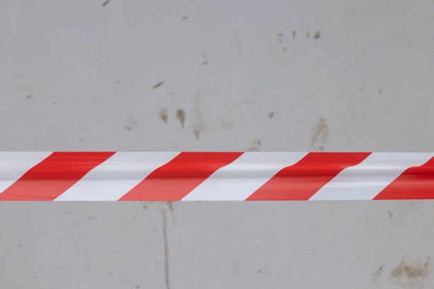 istock A red and white striped tape is on a wall 2159941394