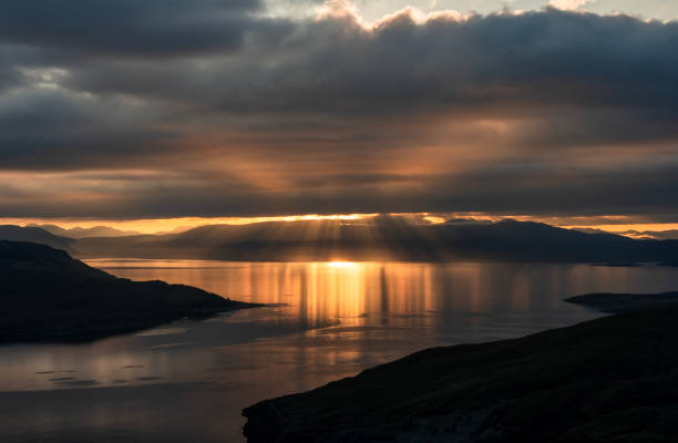 My last morning on my trip to Scotland started with a suitably firey display.  As I climbed the steep eastern slopes of Glamaig, the sun burst through the low clouds that shrouded the Applecross peninsula and lit up the waters of the Inner Sound.  In the distance on the left you can make out the hills of Torridon.