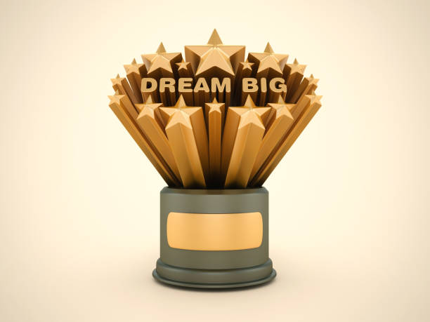 istock Gold Stars with Dream Big Phrase on Trophy 2159946348