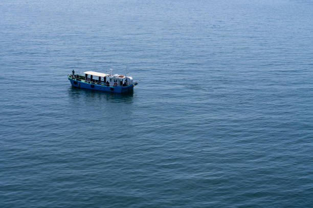 Turquoise water of the Atlantic Ocean and part of the yacht in the foreground. Summer vacation concept background