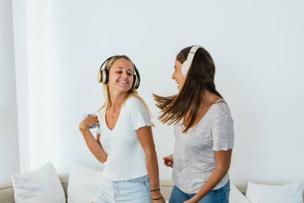 istock Cheerful women dancing while listening to music 2159950164