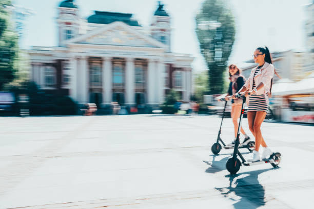 istock Tourists exploring the city on motor scooters 2159952275