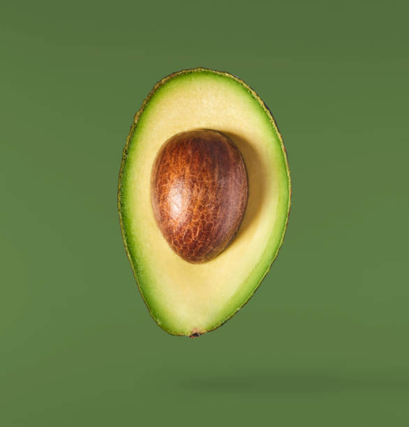 istock Fresh ripe avocado falling in the air isolated 2159952791