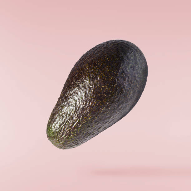 istock Fresh ripe avocado falling in the air isolated 2159952792