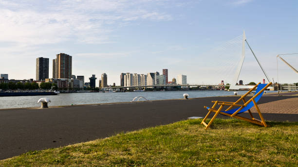 Empty sun lounger by the Erasmus bridge in Rotterdam, Netherlands