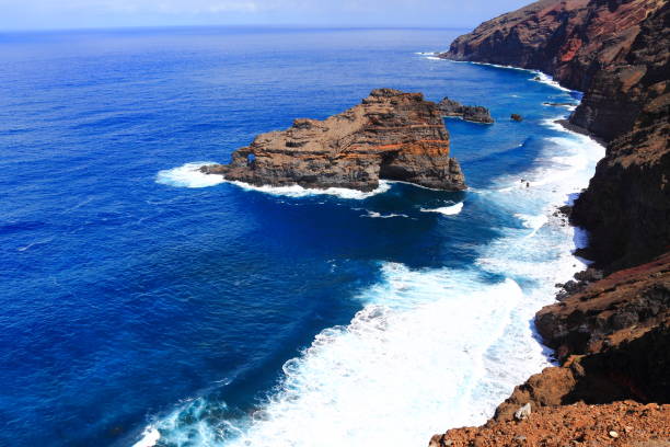 istock Elevated view of waves against a cliff 2159954895