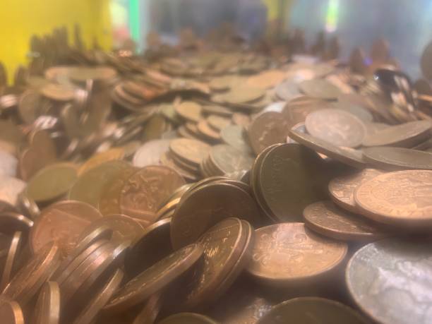 istock Several bronze British 2 pence coins, up close picture 2159955008