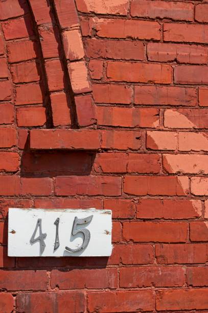 istock House numbers on a brick wall 2159956265
