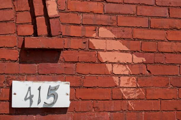 istock House number on a red brick wall 2159956272