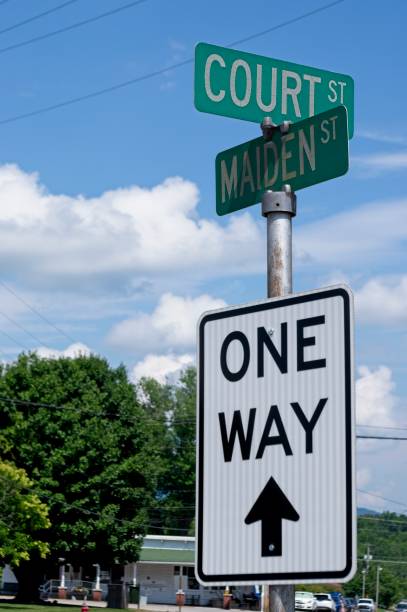 istock Intersection with One Way and street name signs 2159956280