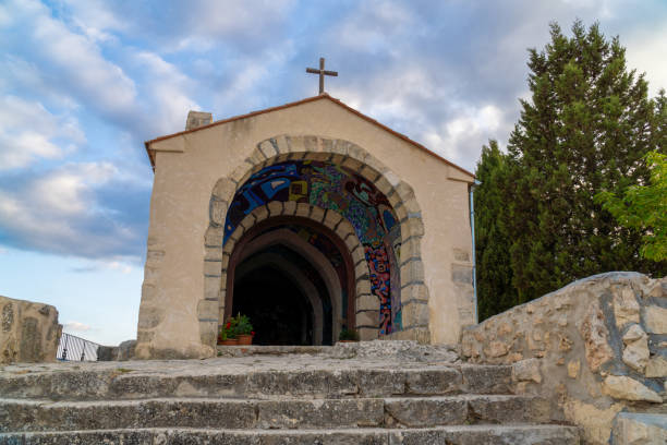 istock Beautiful chapel in the mountains, at sunset 2159956846