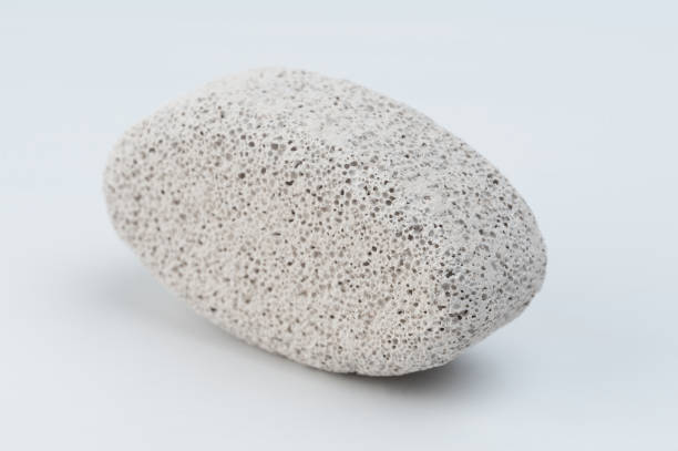 Pedicure stone with pores for scrub skin on  heels isolated on white studio background