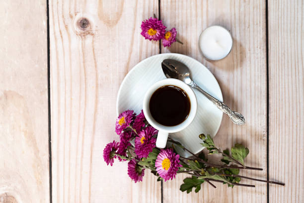 istock Autumn composition. Cup of coffee, notepad, fresh flowers on white background. Autumn, fall concept. Flat lay, top view, copy space 2159960077