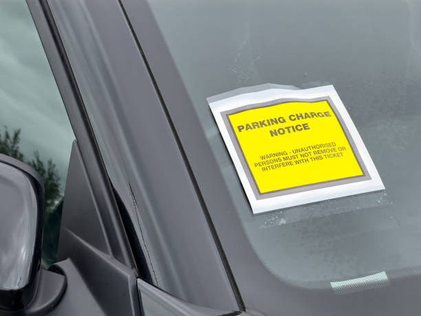istock Parking charge notice attached to car which is parked illegally 2159960150