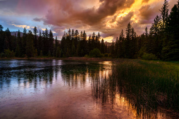 istock Dramatic Mountain Sunset Over Mountain Lake 2159960508