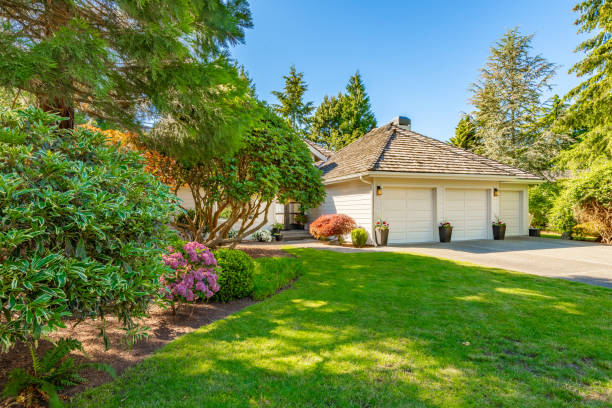 This home has large open concept room painted white with simple and stylish decor. The kitchen has expansive countertops and cupboards and cabinets with gold fixtures. Living room has wall mounted tv and an electric fireplace, the family room has 2 blue recliners and a wood burning fireplace. Rooms have multiple large windows with views to the garden and golf course beyond the backyard. Lush landscaping with mature trees. Bathroom is sparkling clean and white marble with free standing bath tub and open glass wall shower with gold fixtures.