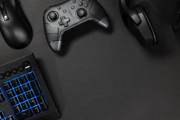 istock Blue lit keyboard with gaming gadgets 2159962509